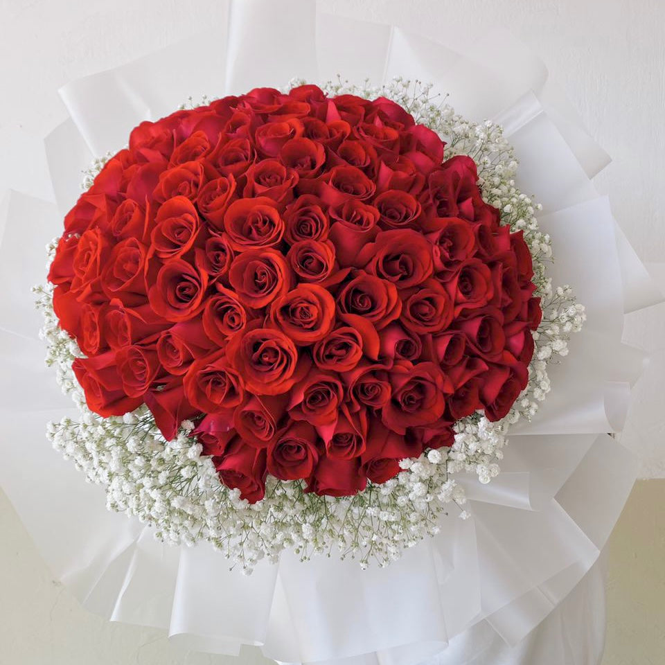 A person holding a bouquet of flowers