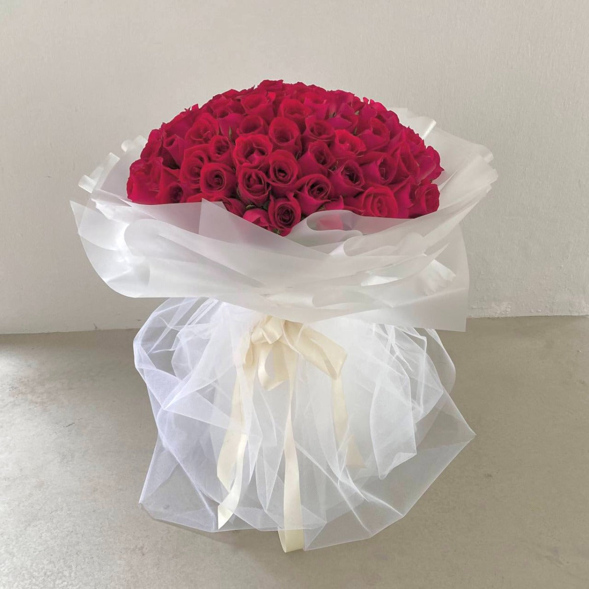 99 Roses - Enchanted Tulle (Red Roses in White Mesh)