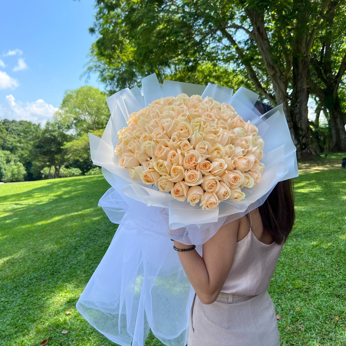 99 Roses - Enchanted Tulle (Champagne Roses in White Mesh)